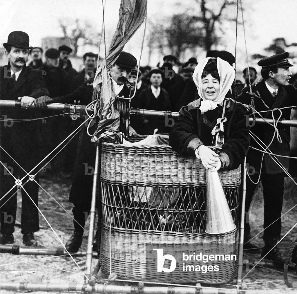 Suffragette Miss Muriel Matters in the basket of a hot air balloon with a megaphone as Suffragettes attempt to disrupt the Opening of Parliament by Airship, 16th February 1909 (b/w photo)