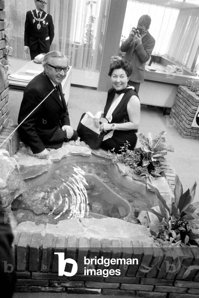 Today, George Brown opened the Facit Office, of Workshop Landscape, at Facit Office Equipment Ltd., Maidstone Road, Rochester, Kent. The Facit Group is one of the World's largest manufacturers of office machines - one of the largest industrial groups in Sweden. George Brown and Anne Kerr, Mp for Rochester and Chatham, sitting by the indoor fishpool. January 1970