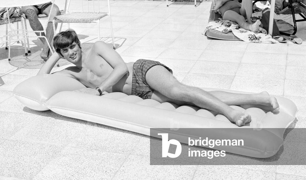George Best relaxing on an inflatable bed whilst on holiday April 1967 (photo)