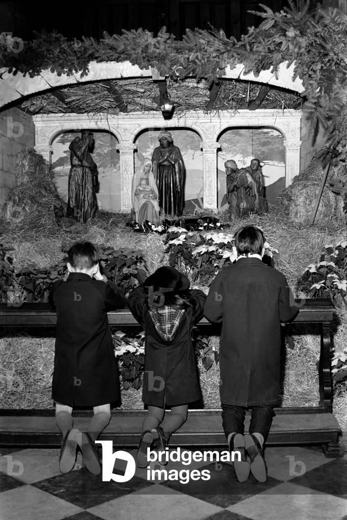 Royal Ballet dancers and pupils of the Royal Ballet School danced under the dome of St Paul's Cathedral . Children say a prayer at the crib. December 1969
