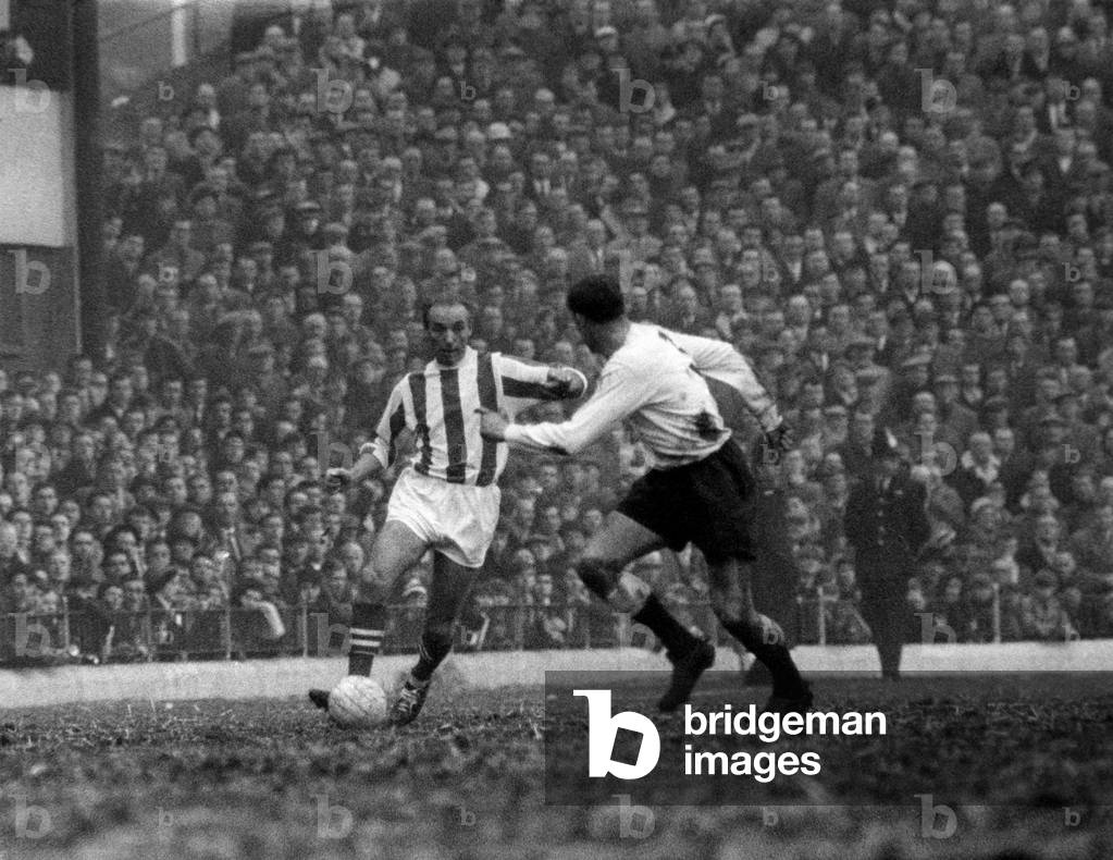 Stoke v Fulham. Stoke supporters just loved it-seeing Stanley Matthews in action again. Here he races down the wing beating Fulham left back Langley to delight of crowd. Febuary 1965 (photo)