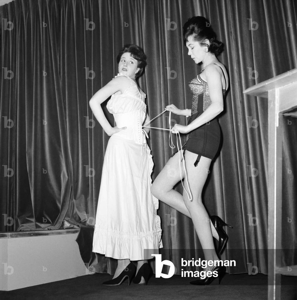 Swimsuit Fashion: Fashion show of Spirella foundation garments and new made-to-measure Swimsuits, was held today at Spirella House, Oxford Circus, Angela Lane and Souilla Glass-Hooper, wearing made-to-measure corrset. June 1960 M4240-005