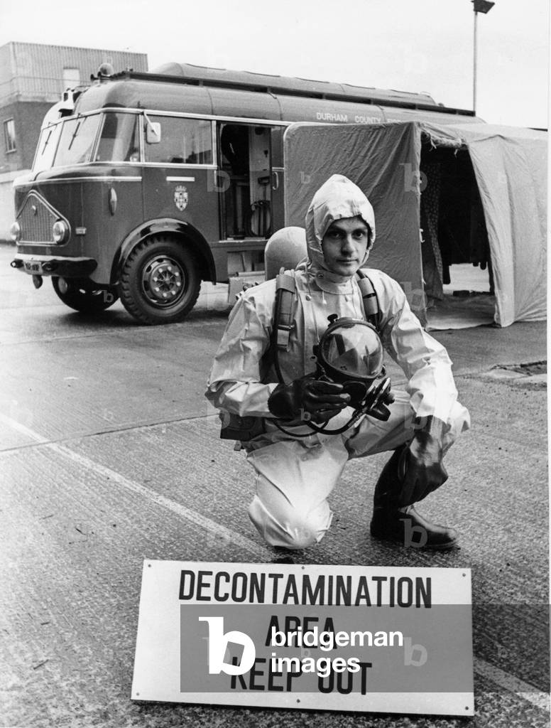 Firefighter Alan Wilson with the complex machinery to combat anything from toxic and radioactive leaks to deadly bugs is being fitted into a converted emergency fire engine, 1970