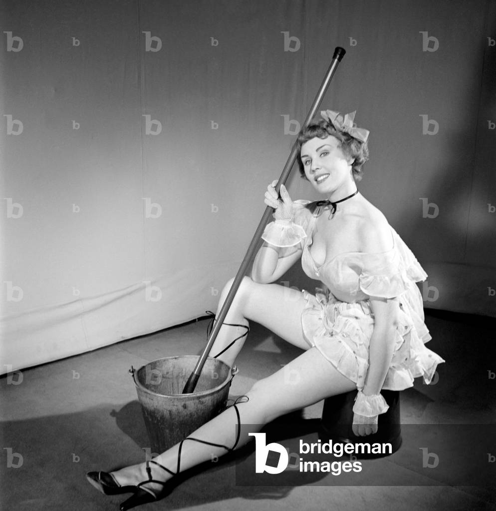 Cleaner wearing fancy dress, 1966 (b/w photo)