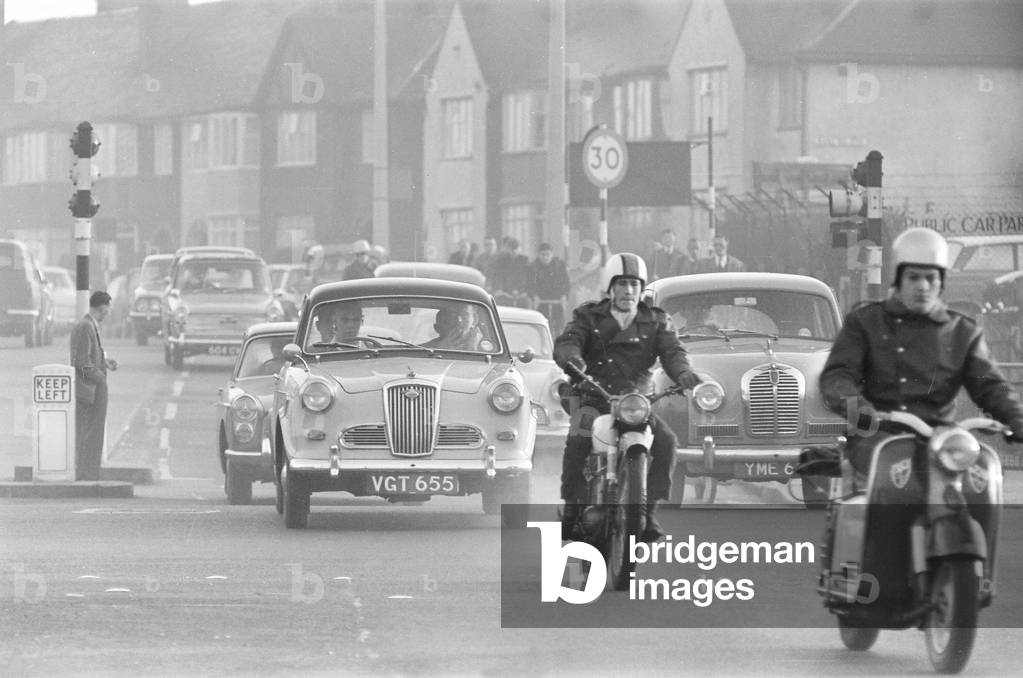 Traffic in High Street Dagenham as the Ford factory turns out at the end of the day shift. 2nd October 1963 (b/w photo)