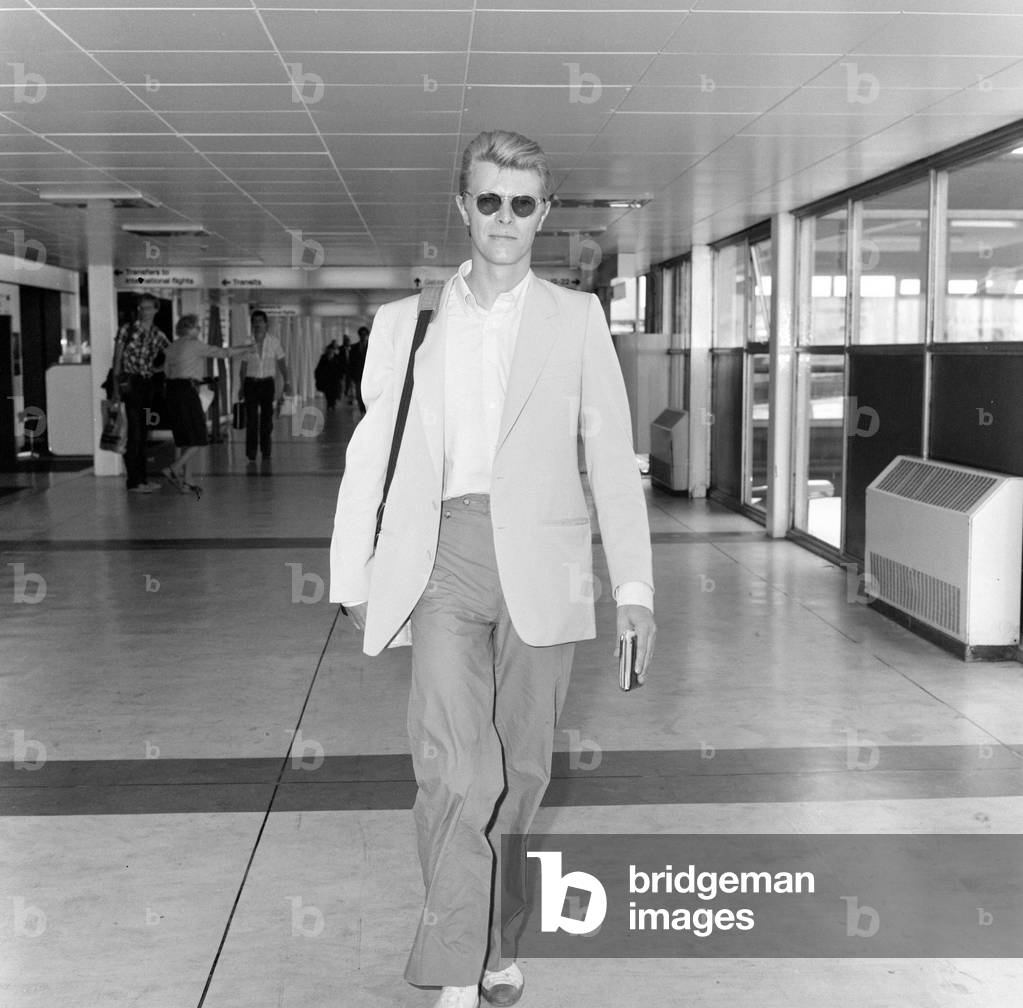 British pop singer David Bowie leaving Heathrow Airport for New York where he is due to make a new film, 5th June 1982 (photo)