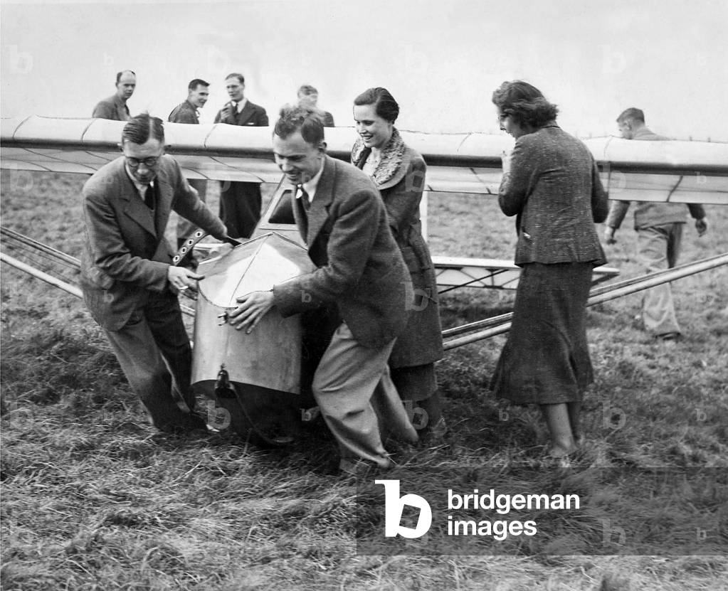 Cramlington Gliding Club members hauling into position their new machine. It is the gift of Mr. W. L. Runciman in March 1938