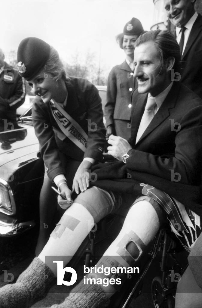 BEA's 'Personality Girl', Heathrow Airport stewardess Heather Angus (21) from Gerrards Cross, Bucks, at the London Hilton Hotel received the keys of her prize, a Ford Cortina 1600E from racing driver Graham Hill. Bea Personality Girl, Heather Angus with Graham Hill. November 1969