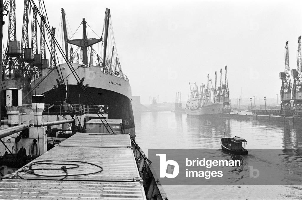 Ships unloading in the docks at Manchester seen through the mist May 1967 (b/w photo)