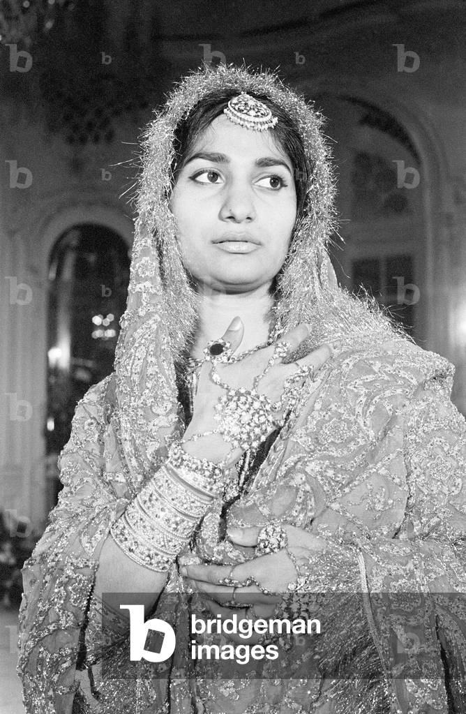 Fashion show featuring Pakistani designs, modelled by young model recently arrived from Pakistan, April 1962.