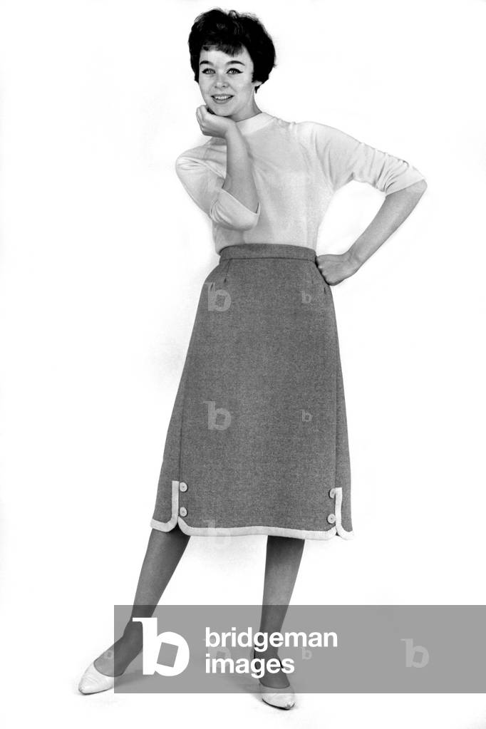 Model Jackie Jackson wearing plain top and lonk skirt. September 1960