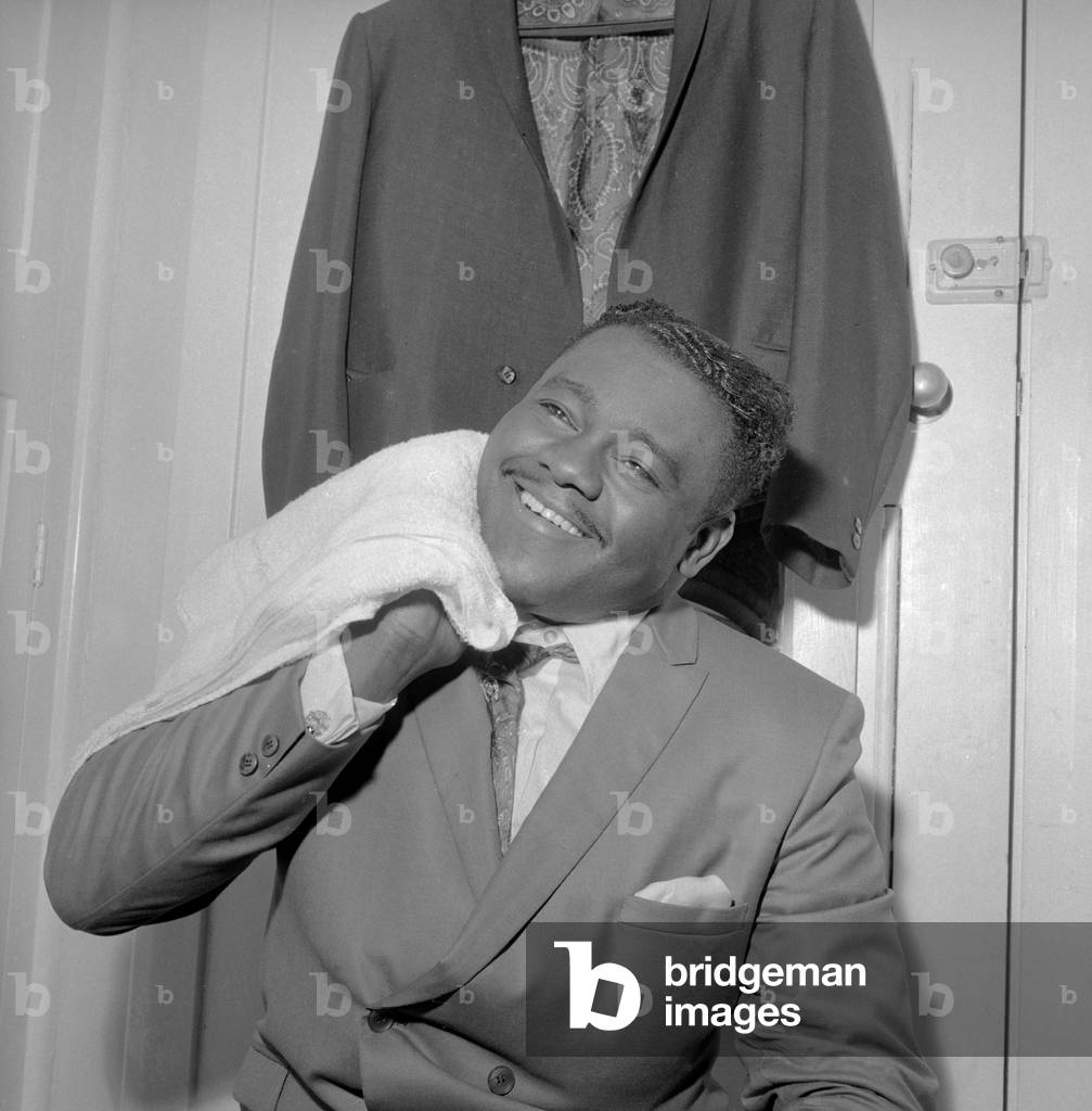American rock and roll star Fats Domino in the dressing room after preparing for the evening show with Gerry and The Pacemakers at the Saville Theatre in London. This is his first performance in Britain. 27th March 1967 (b/w photo)