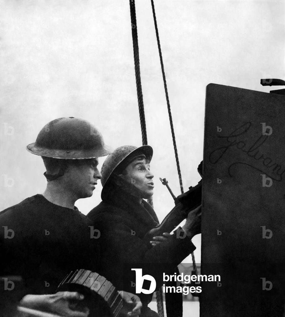 Taffy Williams with his Machine-Gun who by holding back his fire until the last moment succeeded in hitting the German Bomber and brought it down, with the first burst of fire. January 1941
