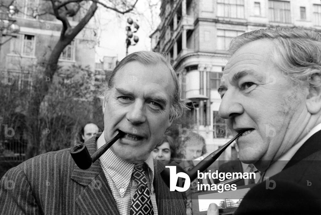 Smoking Pipes: Mr. Campbell Adamson with actor Rupert Davies. January 1975