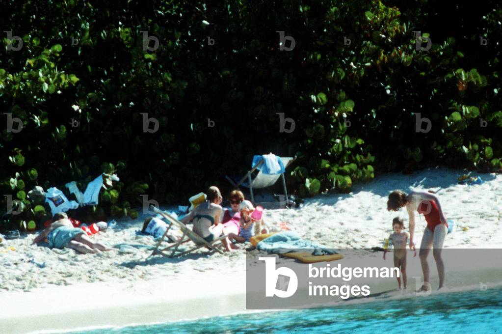 Princess Diana with Prince William and Prince Harry on holiday in the British Virgin Islands and her detective, 09/01/1989 (b/w photo)