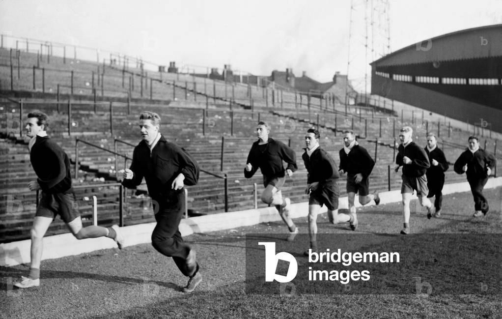 Stoke City players take part in training session, sprinting along the touch line are (left to right) Geoff Hickson, Bobby Cairns, Dickie Cuncliffe and Johnny King, at the Victoria ground, Tuesday 5th January 1960 (photo)