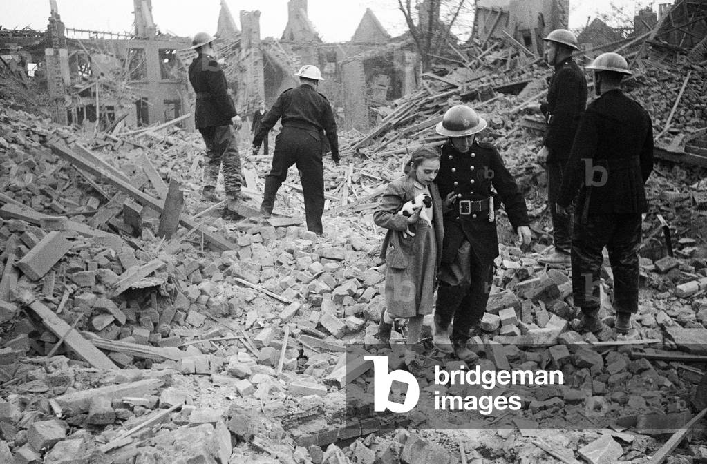 Flying bomb incident at Arundel Road, Leytonstone, London. Scene in the south of England very soon after a flying bomb had crashed. Firemen of the NFS and Civil Defence were soon upon the scene and carried out fine rescue work. Firemen helping a girl from the rubble, 24/07/1944 (b/w photo)