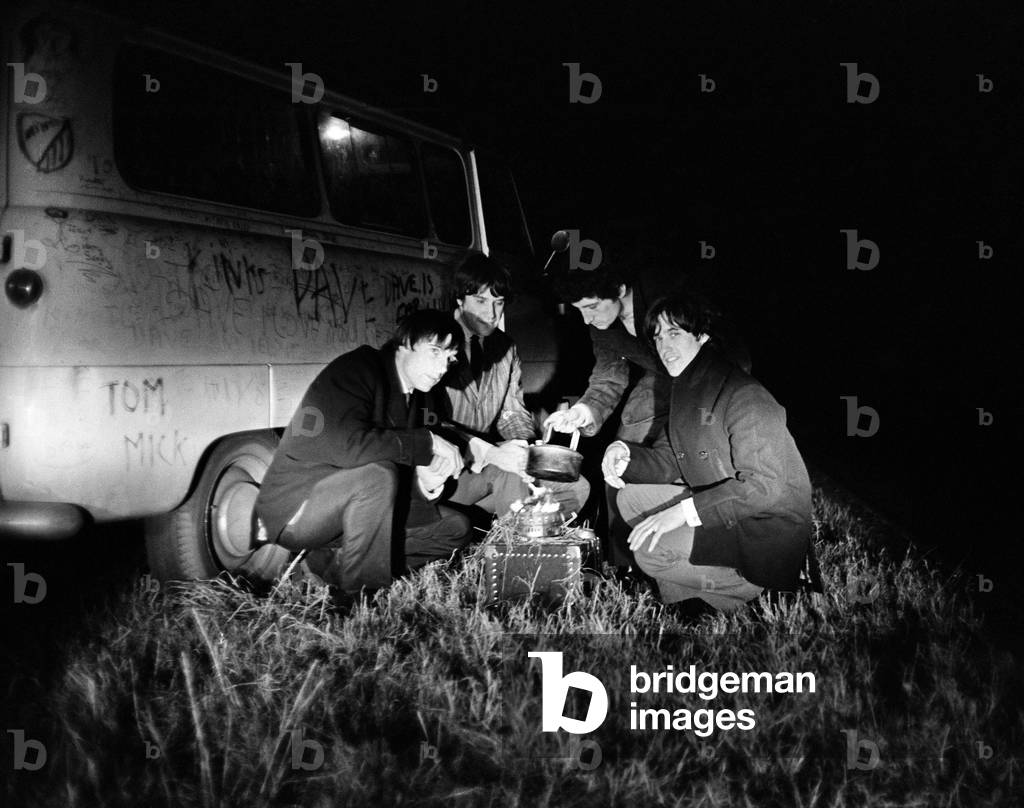 The Kinks pop group September 1964 
Ray Davies and Dave Davies making tea on a stove next to their tour van