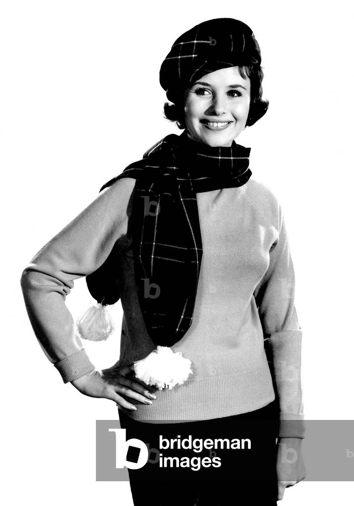 Model Ann Cave wearing scarf and matching hat. 
February 1962