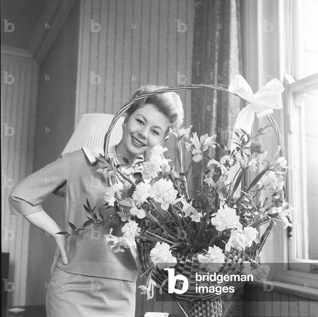 Mitzi Gaynor, American actress, singer & dancer, who is in the UK to promote her new film 'South Pacific' which opens in Manchester tonight, 28th April 1958 (b/w photo)