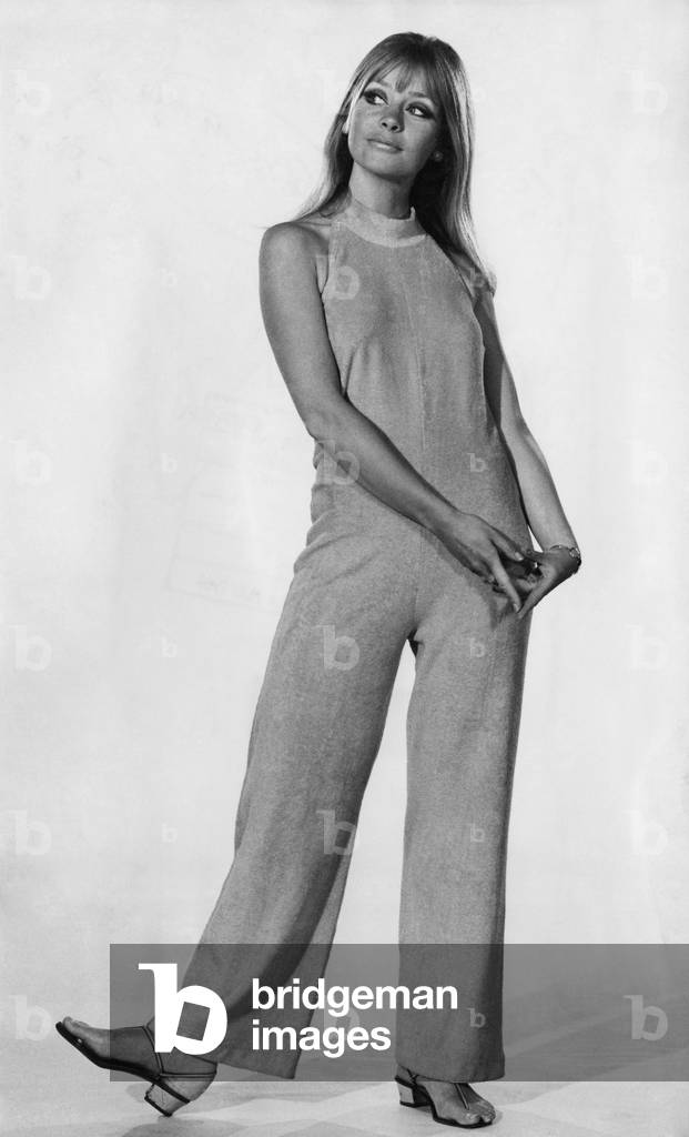 This jumpsuit with its high halter neckline is super for showing off a golden tan. In hot pink towelling. By Jersea of Sweden. 
May 1969