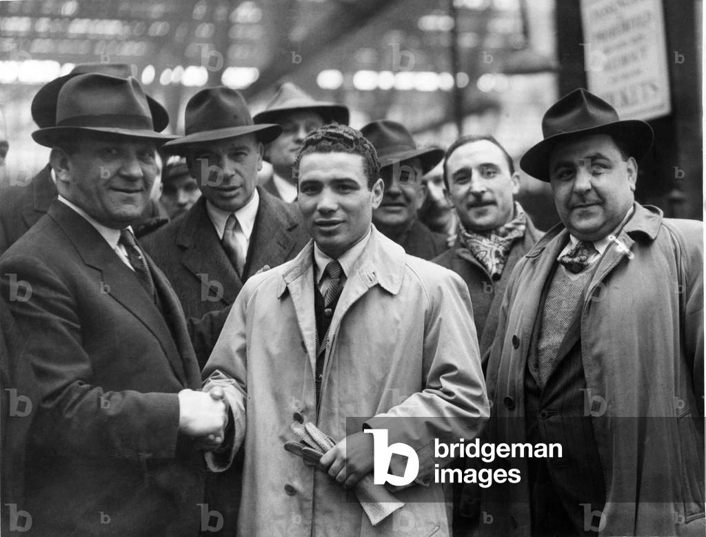 Italian bantamweight boxer Carrado Conti arrives in the UK to fight Jackie Paterson at Kelvin Hall in Glasgow Scotland, 17th April 1947 (b/w photo)