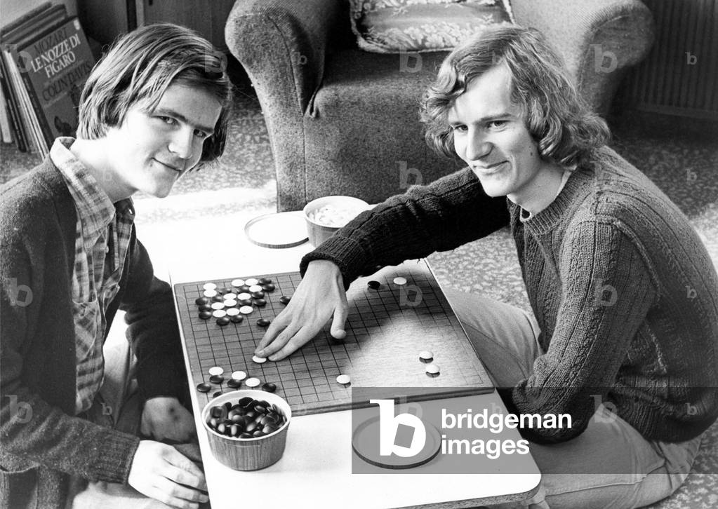 Students playing the new Chinese board game GOin April 1977 (b/w photo)