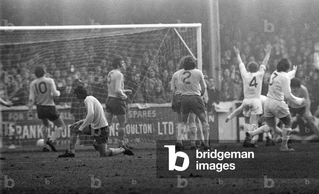 FA Cup Quarter Final match at Elland Road. Leeds United 2 v Tottenham Hotspur 1 Arms raised from Billy Bremner as he celebrates a Leeds goal, 18th March 1972 (b/w photo)