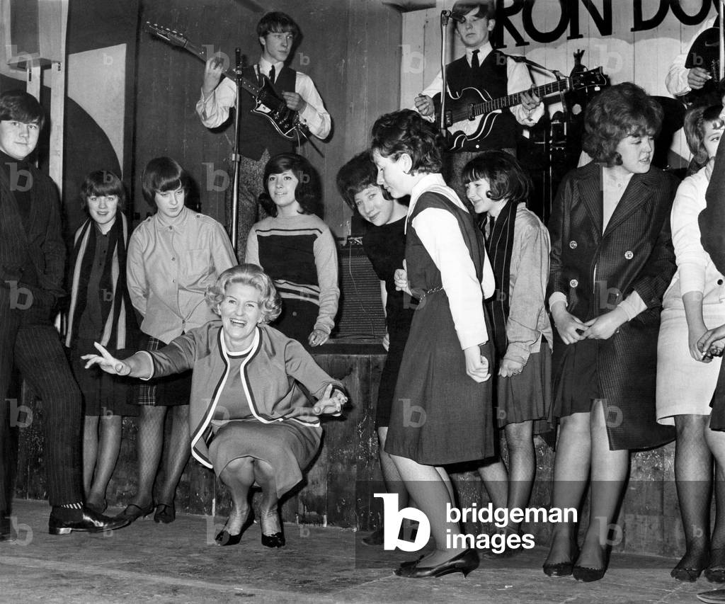 Lady Mavis Pilkington, wife of Sir Harry Pilkington seen here doing the twist at a youth club March 1964