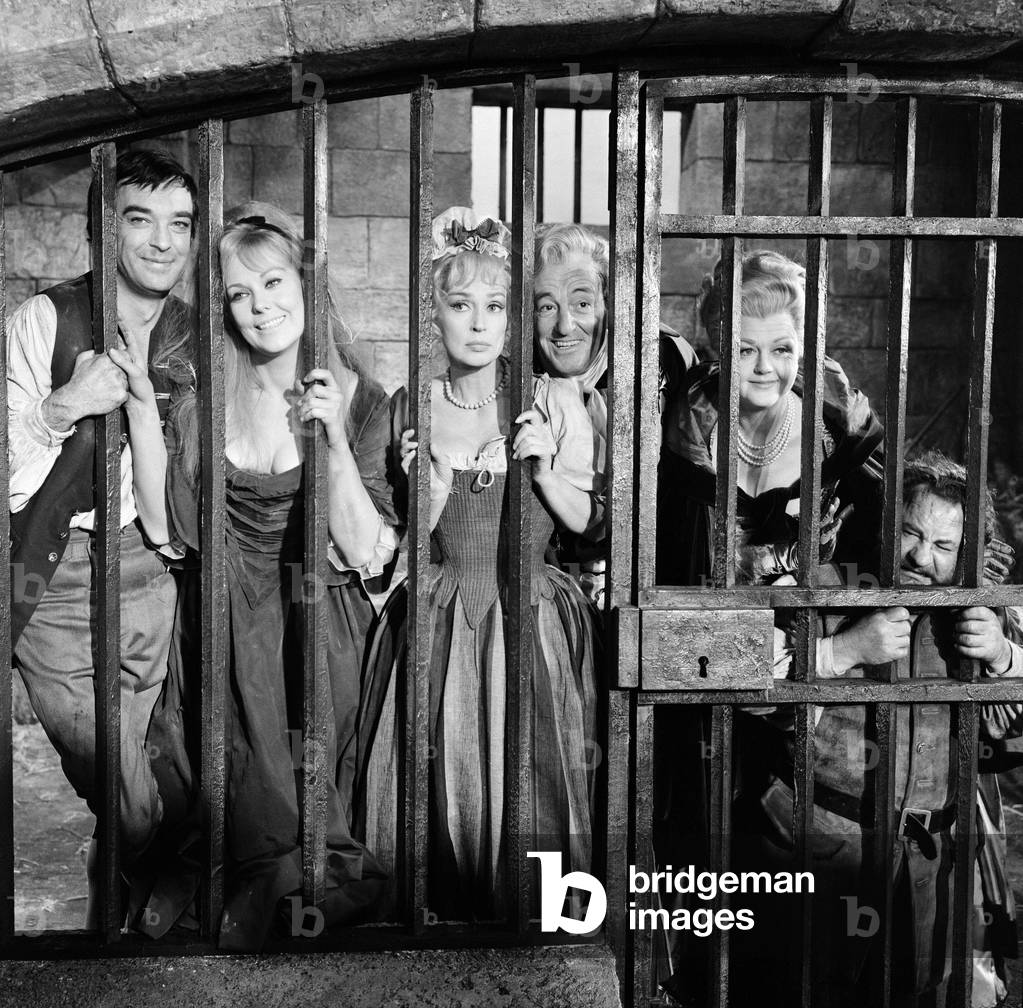 Richard Johnson, Kim Novak, Lilli Palmer, Vittorio De Sica and Angela Lansbury on the set of 'The Amorous Adventures of Moll Flanders' filming a scene set in Newgate Prison, at Shepperton Studios. 11th November 1964 (b/w photo)