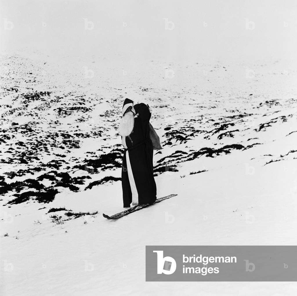 Father Christmas on a pair of skis on the mountain slopes.
31st December 1957.