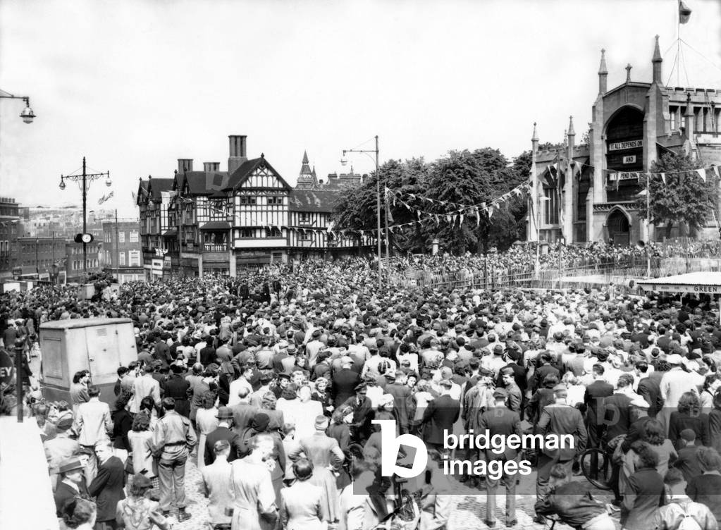 A huge crowd in Broadgate listening to the Prime Minister's radio announcement of the official end of the European war, 8th May 1945 (b/w photo)
