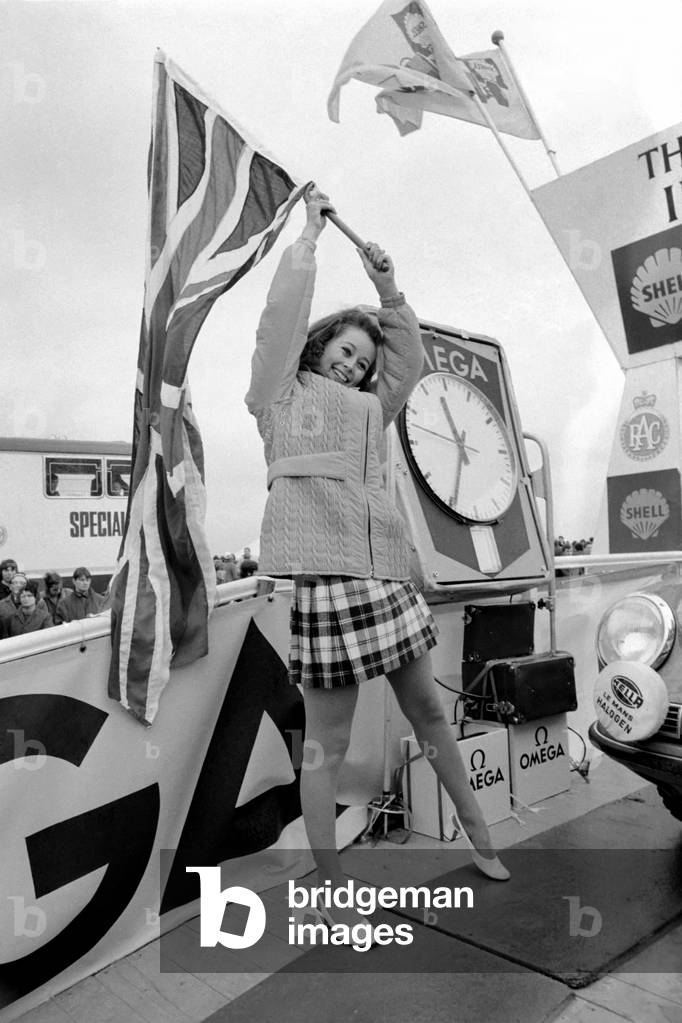 R.A.C. Rally: Miss U.K. Sheena Drummond, Waves the flag for the start of the R.A.C. Rally. November 1969
