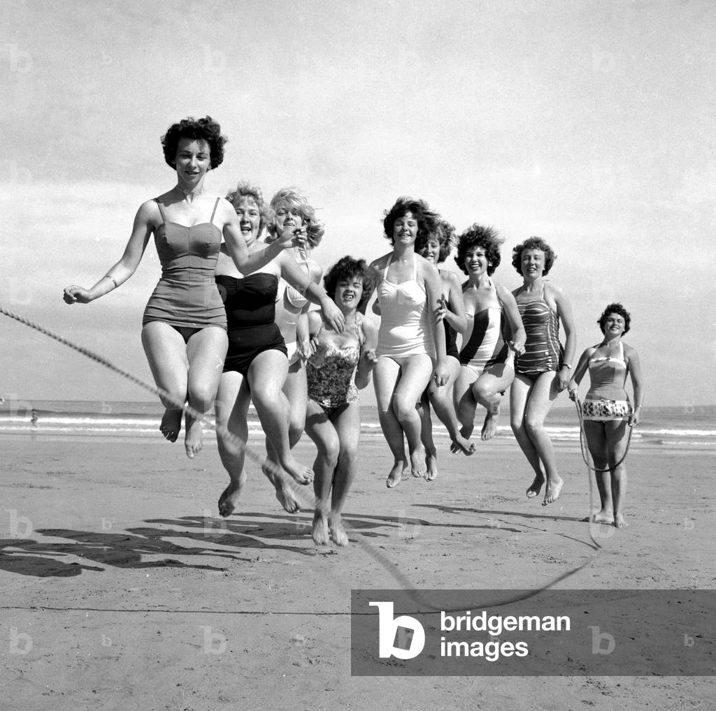 Beauty contest girls playing on the beach at Newquay.
7th July 1960