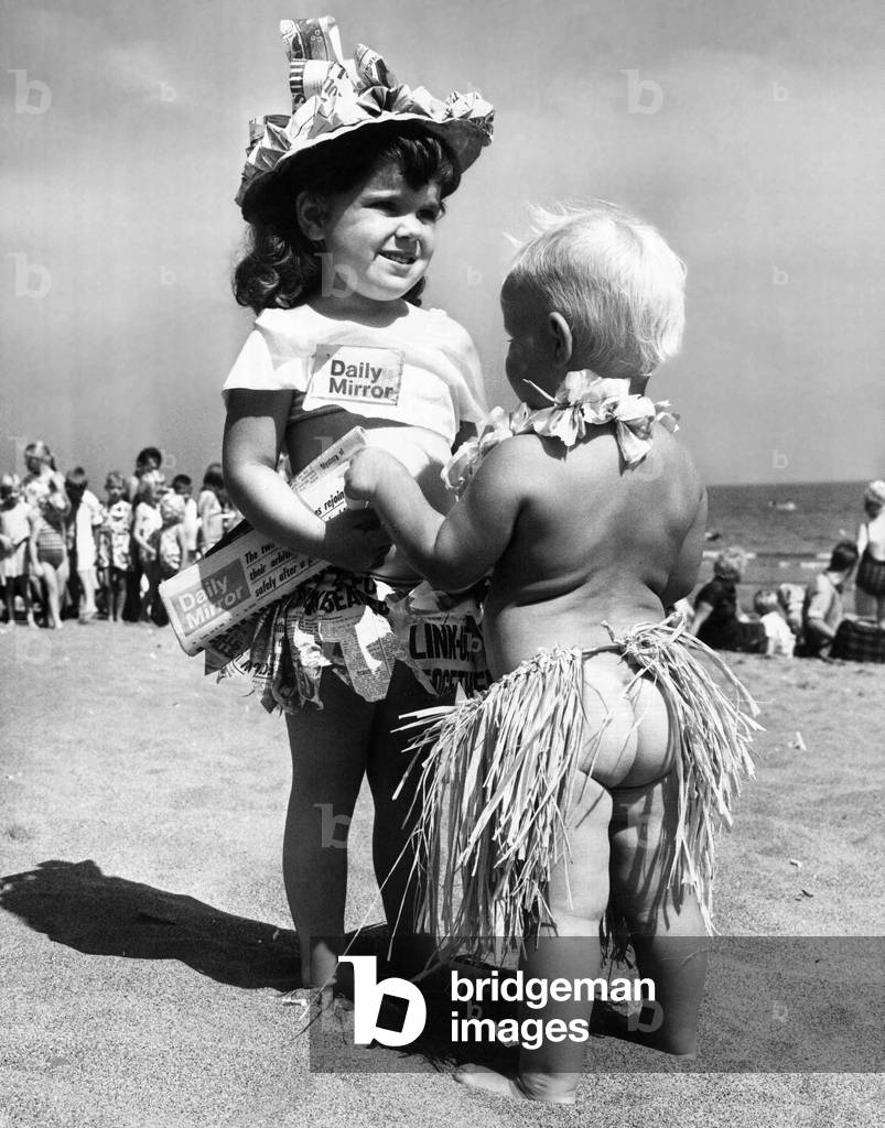 What goes on behind the scenes at a fancy dress competition is usually kept well covered. But this contestant exposed the bare truth during the Daily Mirror Day at Sandown, Isle of Wight and didn't care who knew. 22nd July 1969 (b/w photo)