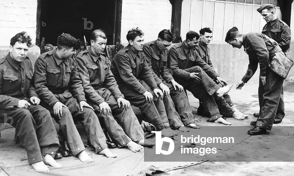 Foot inspection for the Kings Own Yorkshire Light Infantry during WW2, 1940 (b/w photo)