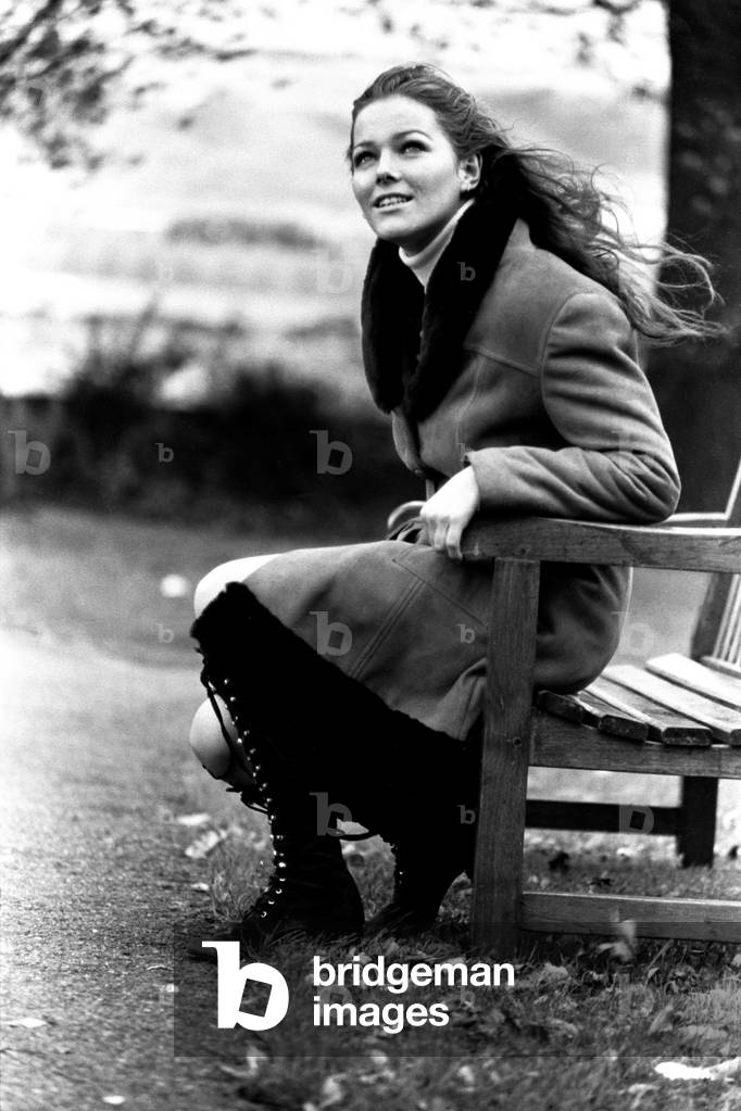 A model wearing a winter coat during a fashion shoot, 26th October 1971 (b/w photo)