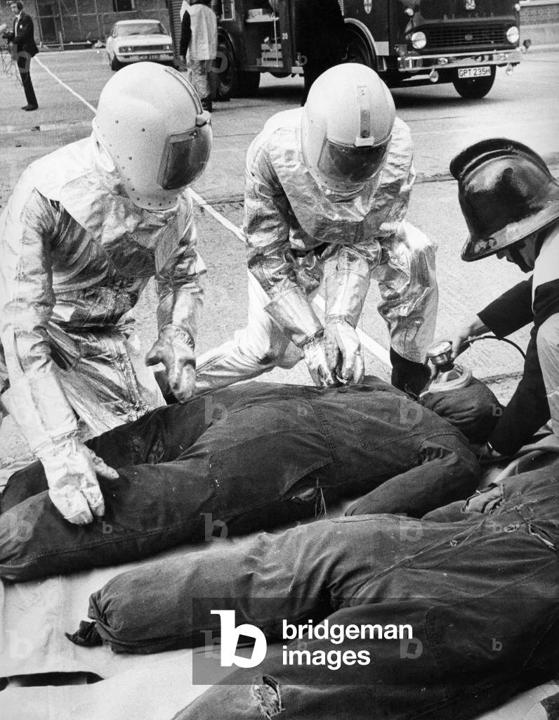 Britain's most modern motorway rescue tender went into action at Durham. Firefighters in astronaut-style protective suits fought their way throught the smoke and wreckage of a two car crash. Of course the victims were just dummies as the team take part in a training exercise, c.1970