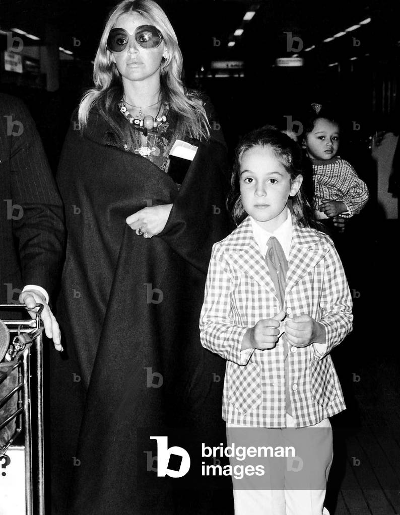 Britt Ekland with her daughter Victoria Sellers at Heathrow airport, 24th May 1973 (b/w photo)