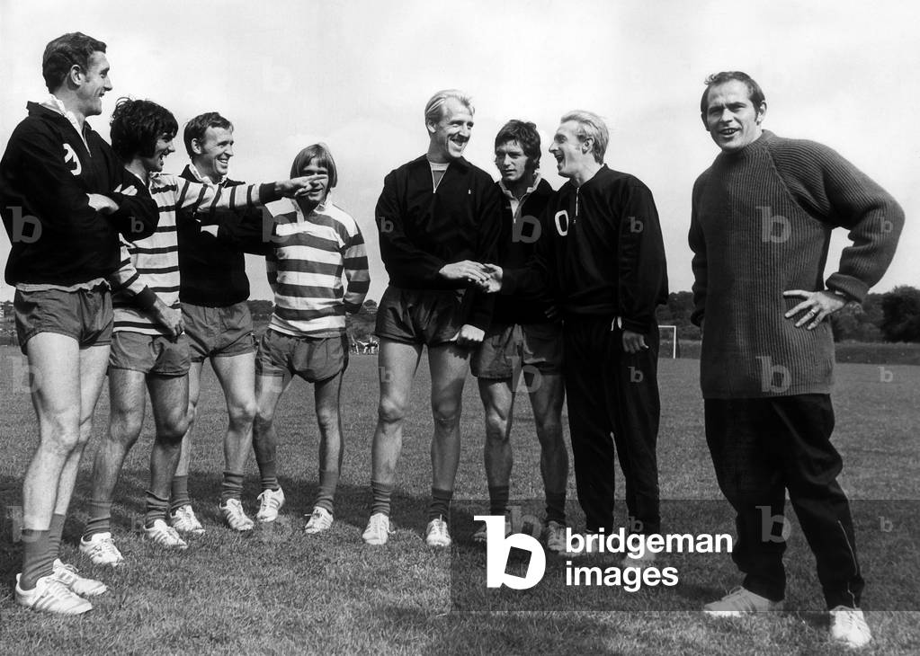 Manchester United football player Ian Ure at their team's training ground with l-r Bill Foulkes, George Best, Pat Crerand, John Fitzpatrick, Willie Morgan, Denis Law and Wilf McGuiness. 23rd August 1969 (photo)
