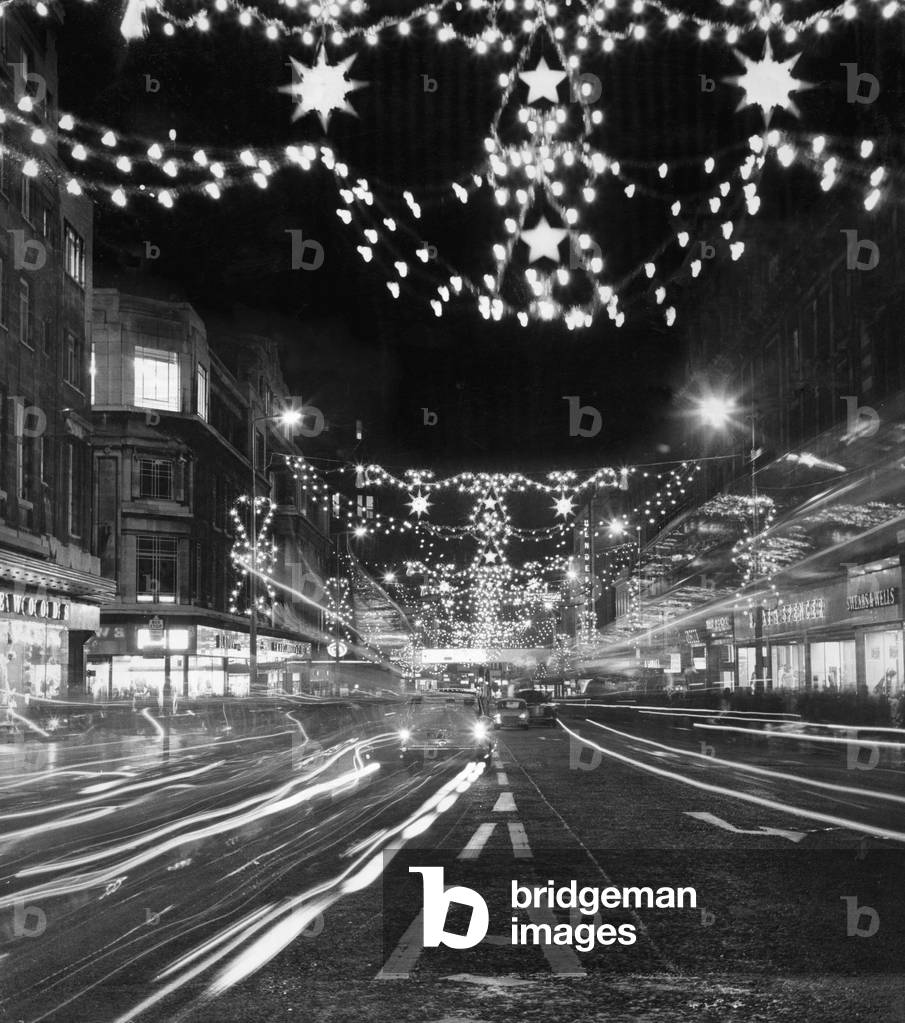The Christmas lights in Church Street, Liverpool shortly after they were switch on by commedian Ken Dodd. 28th November 1969 (b/w photo)