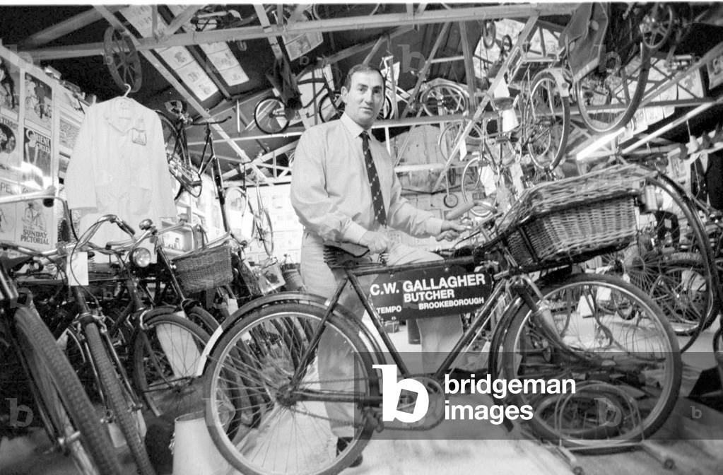 Robert Coalter curator and restorer of vintage bikes at the Brookeborough Vintage Cycle Museum circa 1970s (b/w photo)