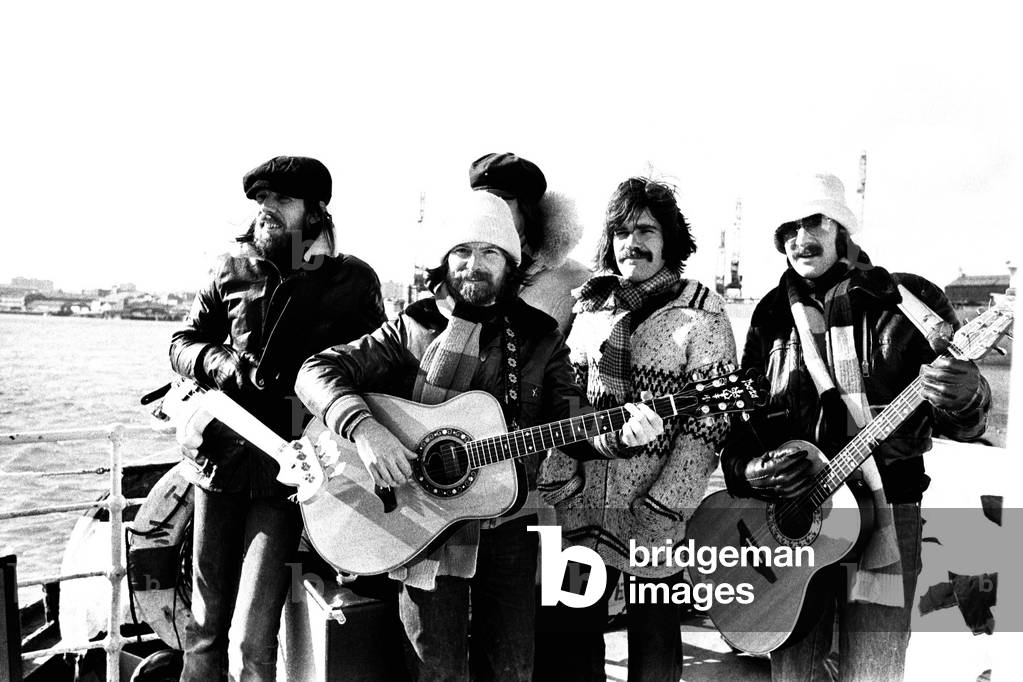 Lindisfarne sailed down the Tyne on a musical journey. The group were filming on board a Tyne ferry for a half-hour television show called 'All Right Now'. (Left to right) Rod Clements, Si Cowe, Ray Laidler, Ray Jackson and Alan Hull 4th March, 1979 (b/w photo)