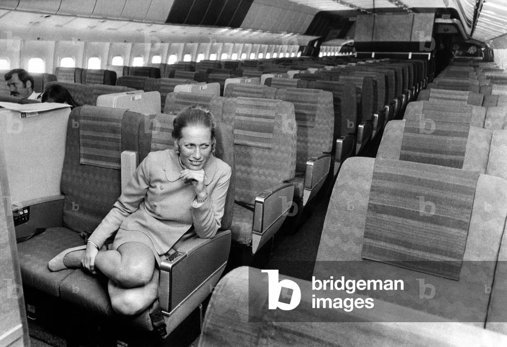 Stewardess Jane Ridley sits in the huge cabin of a Lockheed Tri-Star airliner named 'Halcyon Days' at Newcastle Airport. 16th August, 1972 (b/w photo)