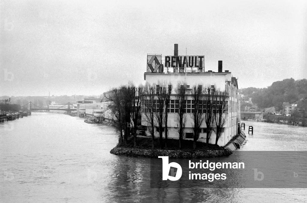 The Renault factory rises from the waters of the Seine like a giant ship Europe's largest motor plant. It is built on the Ile Seguin the plant is flanked by the river, April 1975 (b/w photo)