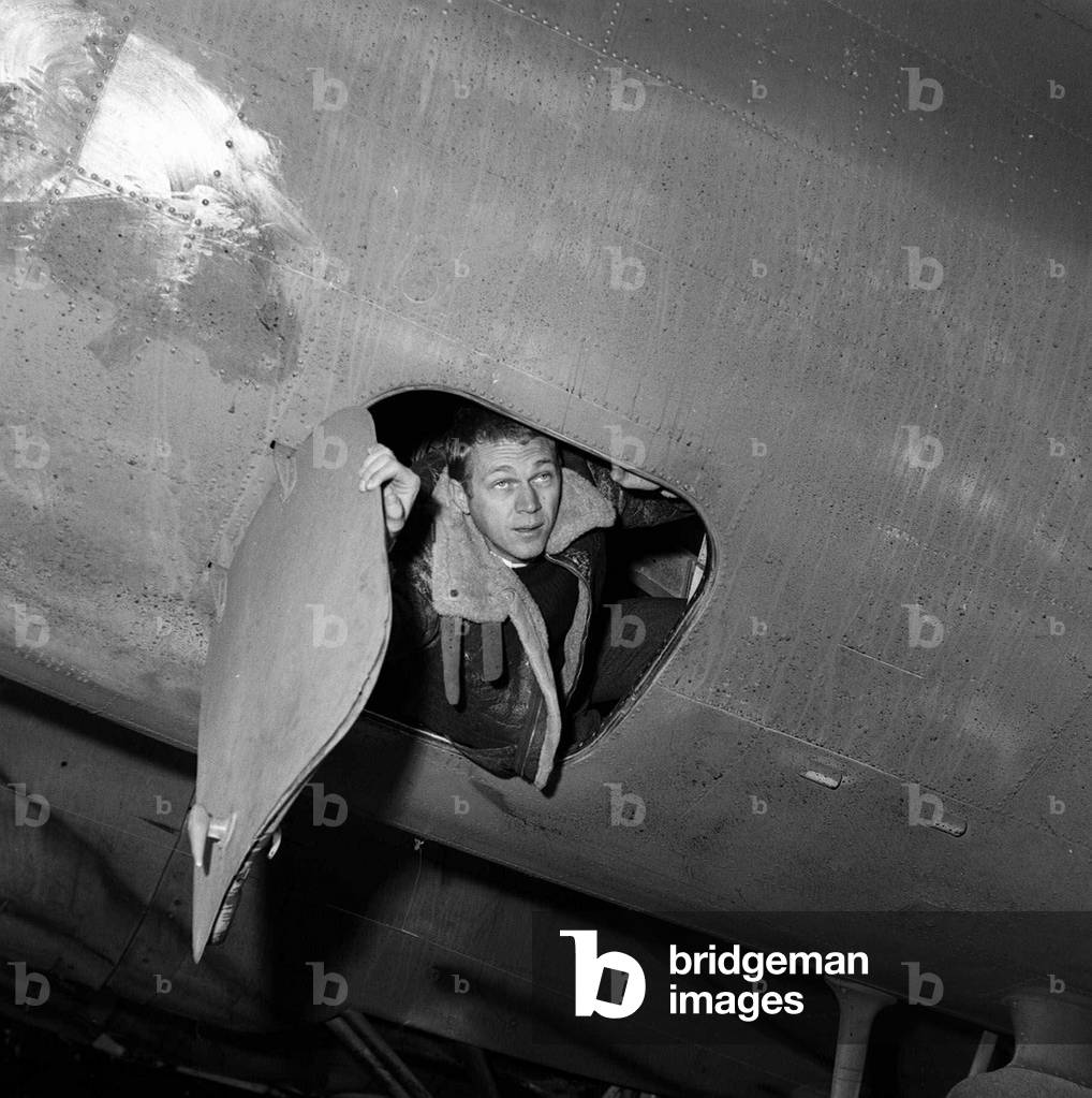 Steve McQueen filming the War Lover standing by Boeing B17 Flying Fortress at RAF Bovingdon aerodromer, November 1961 (b/w photo)