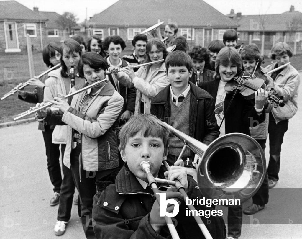 The young musicians at Sacred Heart RC Secondary School in Redcar have a good reason to blow their own trumpets. An 18-strong group , picked from the 104 who make up the school's orchestras, has just returned after a two-day intensive training course at St Mary's College in London. Head of Music, Mr Edward Murphy, accompanied them. 11th April 1981 (b/w photo)