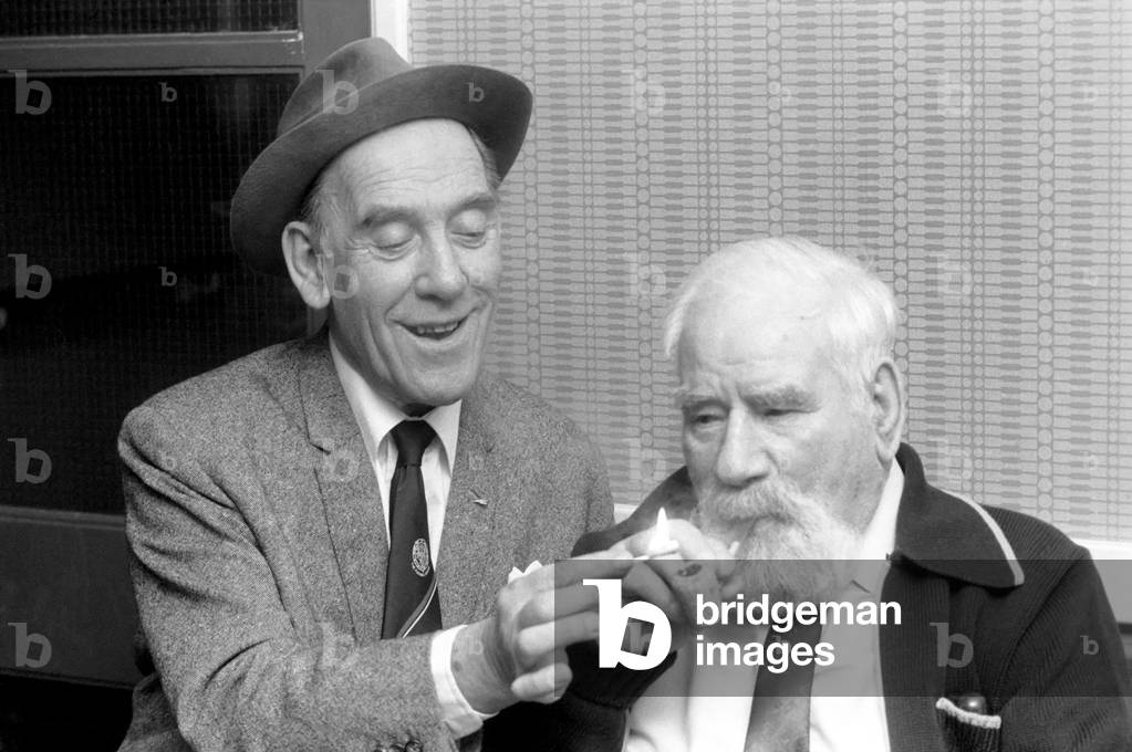 Ex-Sailor Dick Southey with comedian Tommy Trinder. Britain's oldest man, March 1975 (b/w photo)