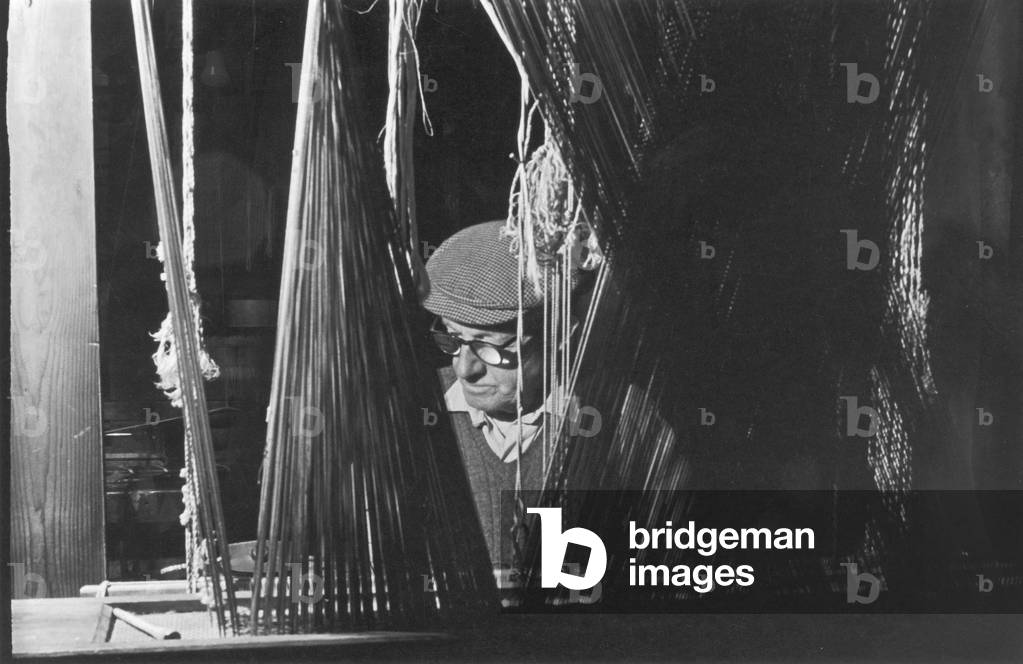 A weaver operating a loom at the Royal Weaving Company in Belfast. Circa 1966