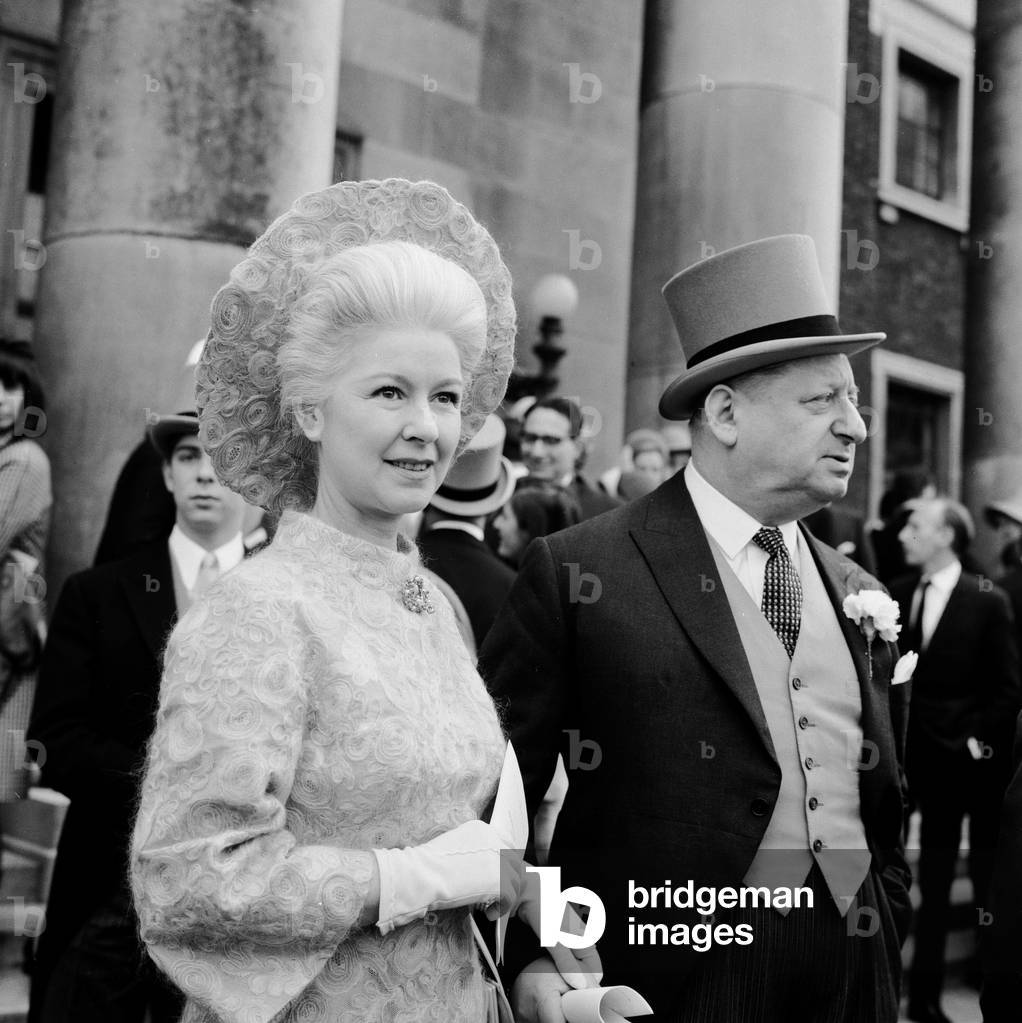 The wedding of Michael Grade, twenty four year old son of Leslie Grade, and his bride Penelope Levinson at St John's Wood Liberal Synagogue. Here the groom's brother Lew Grade with his wife. 19th March 1967 (b/w photo)